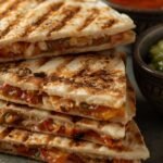 Grilled chicken quesadillas served with salsa and guacamole – delicious hot lunch idea for work or school
