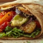“Healthy vegetarian wrap with grilled veggies, avocado, quinoa, and hummus — a perfect recipe remix for lunch or dinner.”