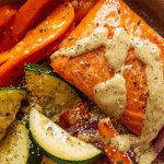 Beef and sweet potato skillet with garlic sautéed greens in a cast iron pan