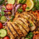 High-protein salad with grilled chicken breast, quinoa, chickpeas, fresh vegetables, and lemon dressing — easy healthy lunch recipe for weight loss and muscle gain.