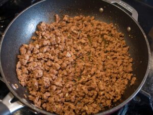 Ground beef cooking in skillet