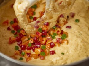 Very tiny, finely sliced bright red and green honey-glazed candied fruits folded evenly into moist buttermilk bread batter
