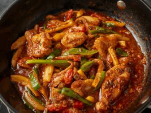 Beef and broccoli with carrot and bell pepper stir-fried in sauce